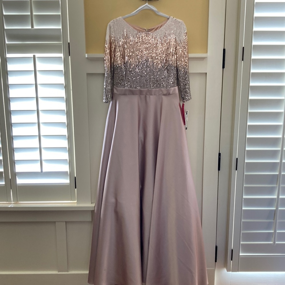 Beaded ball gown with pockets. Size 12. Never worn. $250.